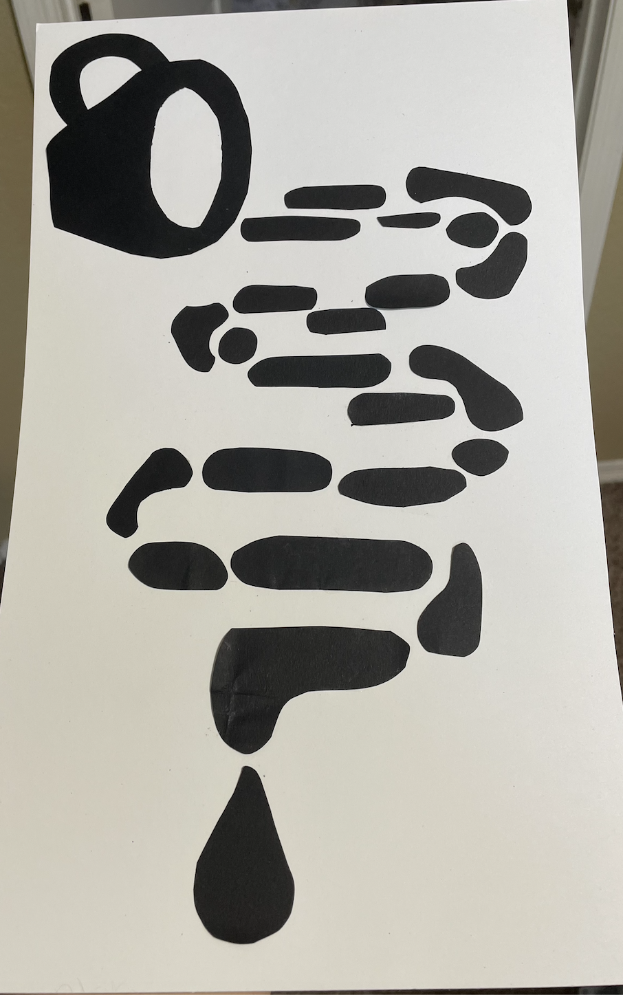 Gestalt principle of continuity represented with pieces of black paper